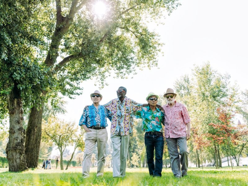 group of senior friends playing at the park